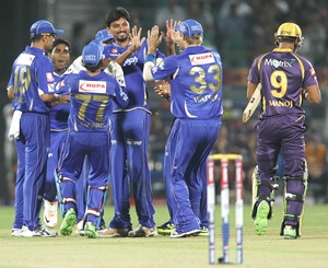 Trivedi is congratulated by teammates