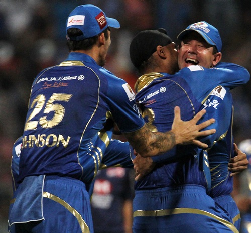 Mumbai Indians' Harbhajan Singh celebrates a wicket with Ricky Ponting