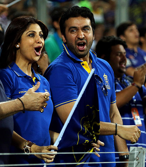 Shilpa Shetty and Raj Kundra joyous after the fall of a wicket during a match between Pune Warriors India and the Rajasthan Royals on Thursday