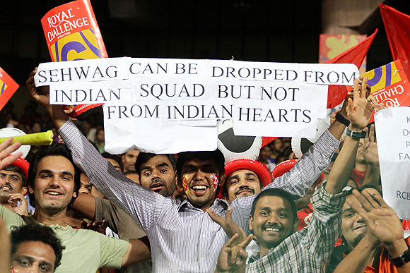 Fans display a banner in support of Virender Sehwag during the match on Tuesday