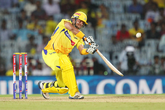 Suresh Raina launches a Shane Watson delivery into the stands for six
