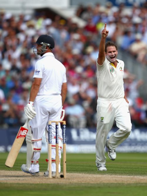 Ryan Harris of Australia celebrates after taking the wicket of Jonathan Trott
