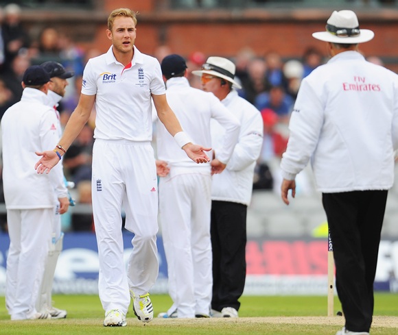 Stuart Broad of England gestures to umpire Tony Hill