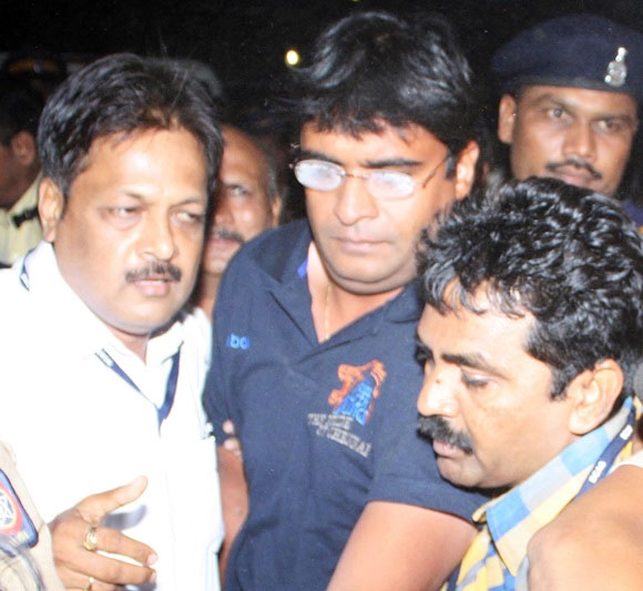 Gurunath Meiyappan (centre) with police officials