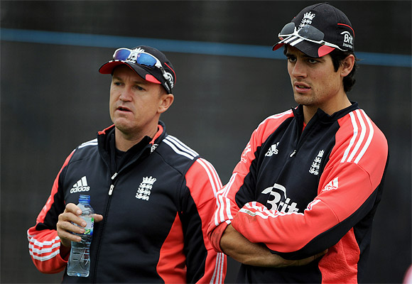 England captain Alastair Cook looks on with coach Andy Flower during a nets session