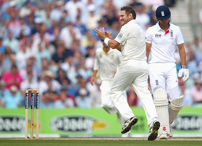 Ryan Harris of Australia celebrates after taking the wicket of Alastair Cook of England on Friday