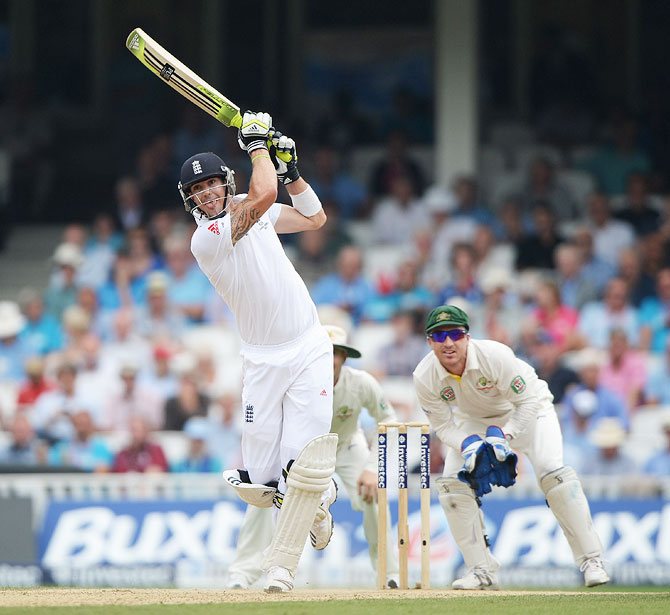 Kevin Pietersen hits a boundary as Australian wicketkeeper Brad Haddin watches on Day 3 of the 5th Ashes Test on Friday
