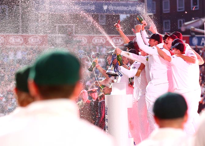 The England team celebrate after winning the Ashes