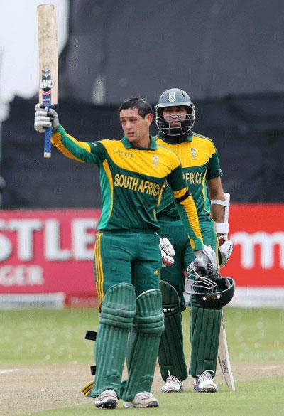 Quinton de Kock celebrates his hundred as Hashim Amla looks on