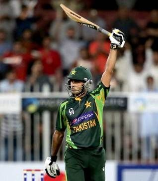 Mohammad Hafeez celebrates after reaching his century