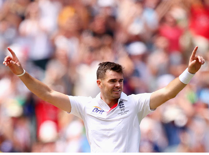 James Anderson of England celebrates taking the wicket of David Warner of Australia