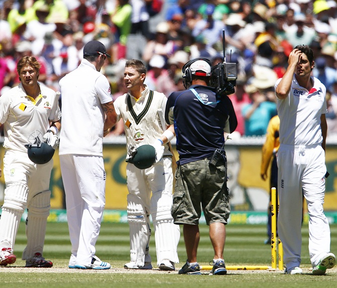 England's captain Alastair Cook (right) reacts as Australia's captain Michael Clarke (third right) shakes hands with England's Kevin Pietersen (third left), after England lost their fourth Ashes Test