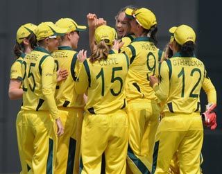 The Australian women's cricket team celebrate a wicket