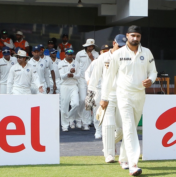 Harbhajan Singh leads the Indian team out on the field on Day 1 of the 1st Test