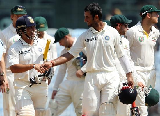 Sachin Tendulkar and Cheteshwar Pujara celebrate after India's win