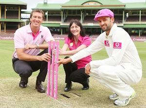 Glenn McGrath, McGrath Breast Care nurse, Karen Miles and Nathan Lyon of Australia pose