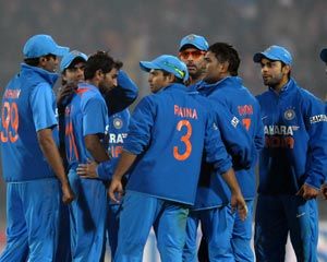 Indian players celebrate after picking up a wicket