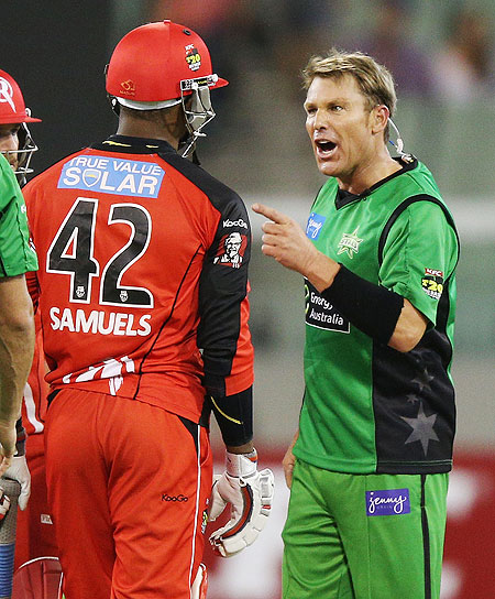 Shane Warne of the Melbourne Stars has a heated exchange with Marlon Samuels of the Melbourne Renegades during their Big Bash League match on Sunday