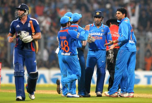 Indian players celebrate after a fall of England wicket