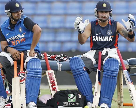 India's captain Virat Kohli (right) and Suresh Raina