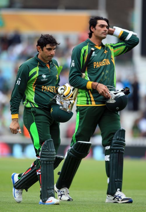 Misbah-ul-Haq and Mohammed Irfan of Pakistan walk off at the end of the innings during the ICC Champions Trophy group B match