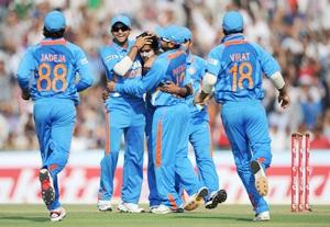 Team India celebrates the fall of a wicket