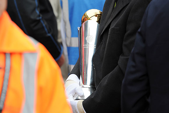 The ICC Champions Trophy is carried off the pitch