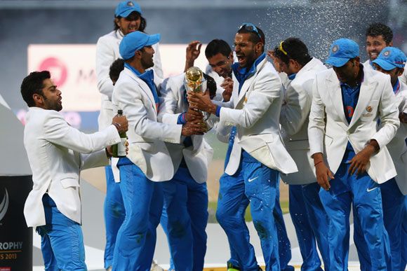 The Indian team celebrate with winners trophy as they celebrate their Champions Trophy win in 2013