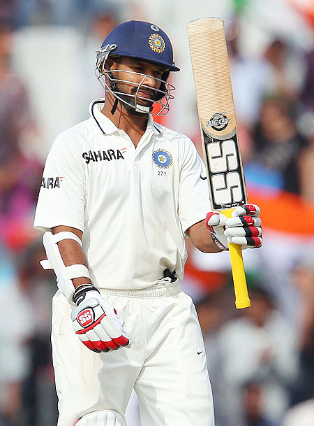 Shikhar Dhawan celebrates on completing 150 runs in Mohali on Saturday