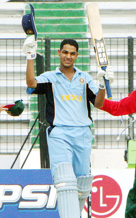 Indian batsman Shikhar Dhawan acknowledges the crowd after scoring a century against Bangladesh in the Under-19 cricket World Cup match in Dhaka on February 20, 2004