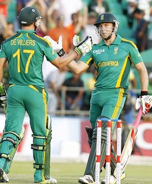 South Africa's David Miller (right) is congratulated by captain AB de Villiers