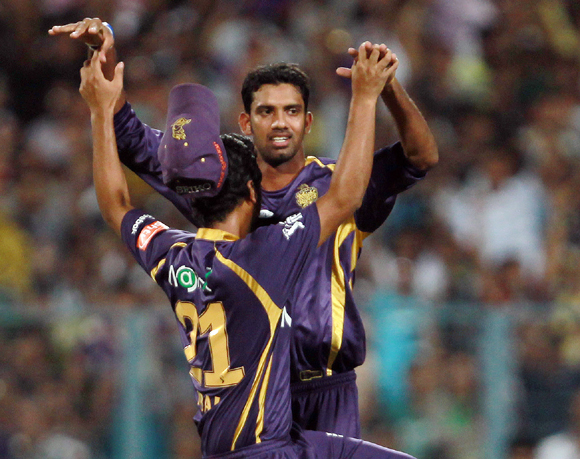 Sachitra Senanayake is congratulated by his teammates after taking the wicket of Ajinkya Rahane
