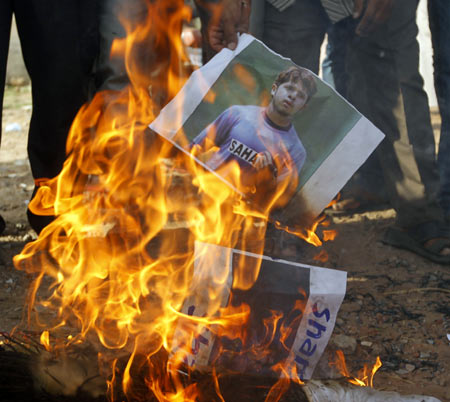 Demonstrators burn a poster of S Sreesanth during a protest in Ahmedabad