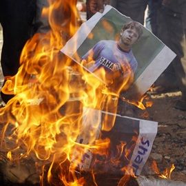 People burn Sreesath's picture in protest