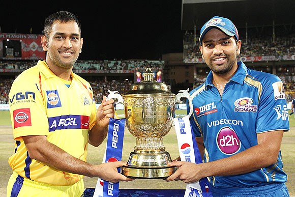 Mumbai Indians captain Rohit Sharma and CSK captain MS Dhoni with the IPL trophy before the match