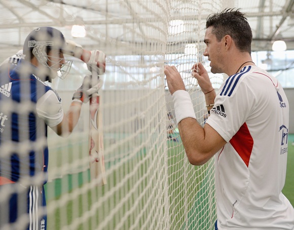 Kevin Pietersen of England speaks with Steven Finn