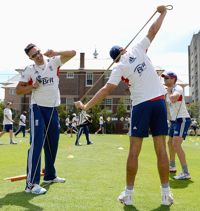 Kevin Pietersen and Alastair Cook of England warm up ahead of an England nets session