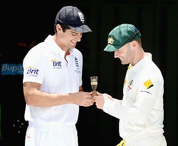 England captain Alastair Cook and Australia captain Michael Clarke hold a replica of the Ashes urn during an Ashes captain's photocall at The Gabba in Brisbane on Tuesday