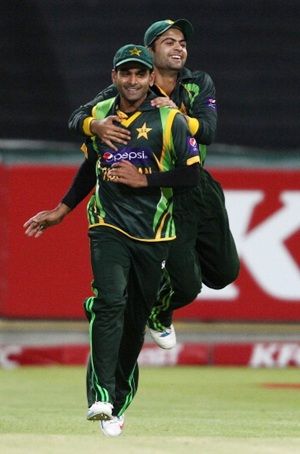 Pakistan captain Mohammad Hafeez and Ahmed Shehzad celebrate victory