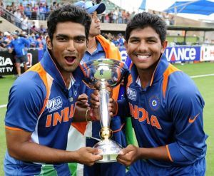 Vijay Zol (left) and Akhil Herwadkar celebrate with the trophy after India's triumph in the 2012 ICC Under-19 Cricket World Cup