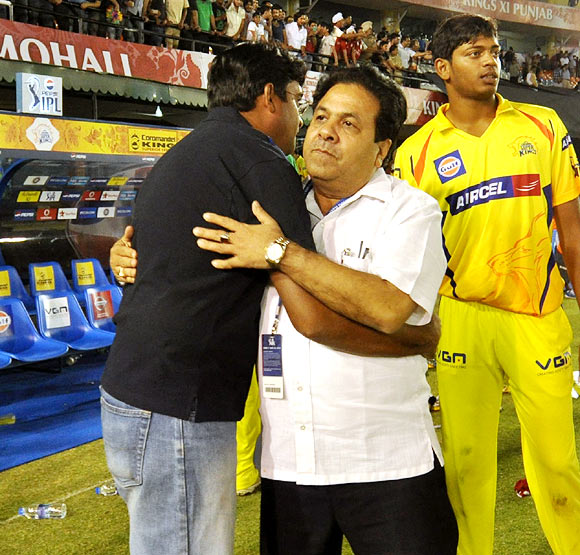 Gurunath Meiyappan (left) hugs IPL chairman Rajeev Shukla