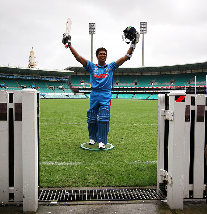 A wax figure of Indian cricketer Sachin Tendulkar stands on the Sydney Cricket Ground during a promotional event for Madame Tussauds wax museum in April 2013