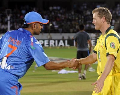 India captain Mahendra Singh Dhoni (left) with Australia captain George Bailey