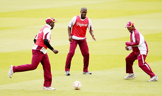 West Indies captain Darren Sammy (centre) with teammates during a nets session
