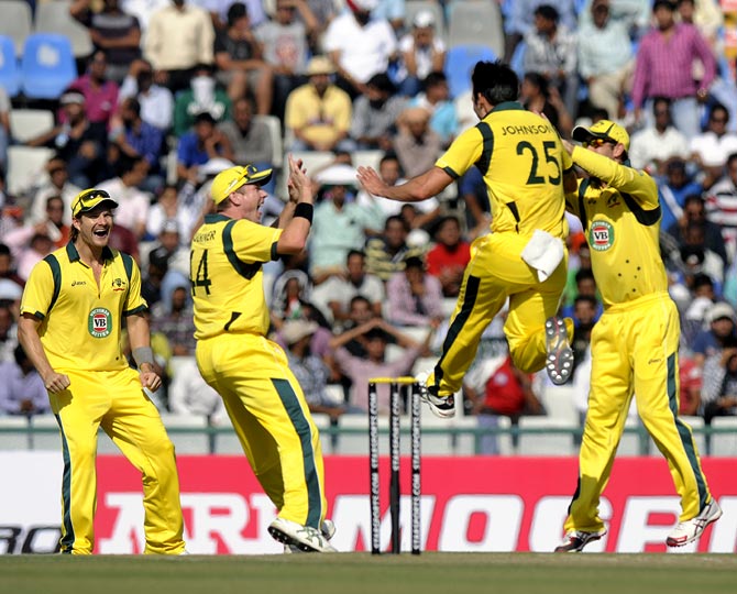 Mitchell Johnson celebrates after picking up a wicket