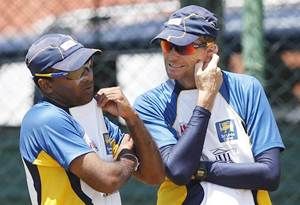 Sri Lanka captain Mahela Jayawardene (left) talks with coach Graham Ford during a practice session