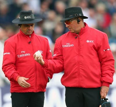 Umpires Tim Robinson and Aleem Dar inspect the ball during the 3rd NatWest Series ODI match between England and New Zealand at Trent Bridge on June 5, 2013