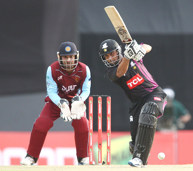 Muhammad Salman of the Faisalabad Wolves drives a delivery during the match against Kandurata Maroons on Friday