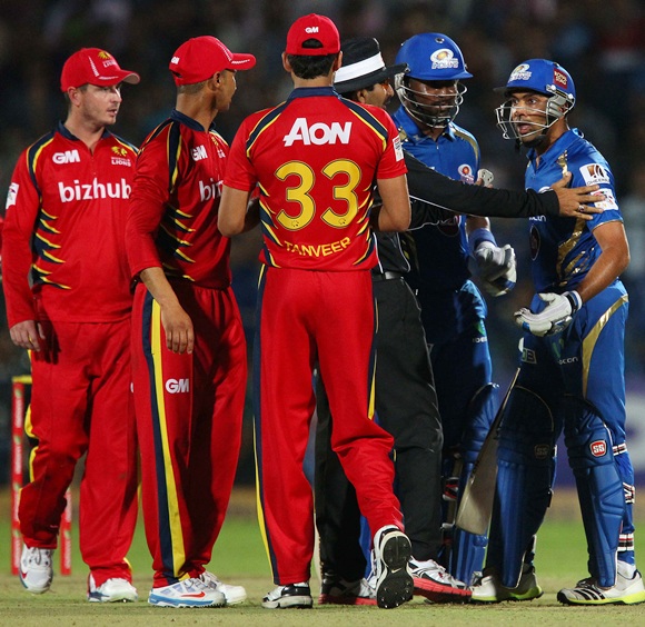 Mumbai Indians captain Rohit Sharma has words with the umpire after a clash with Hardus Viljoen of the Highveld Lions