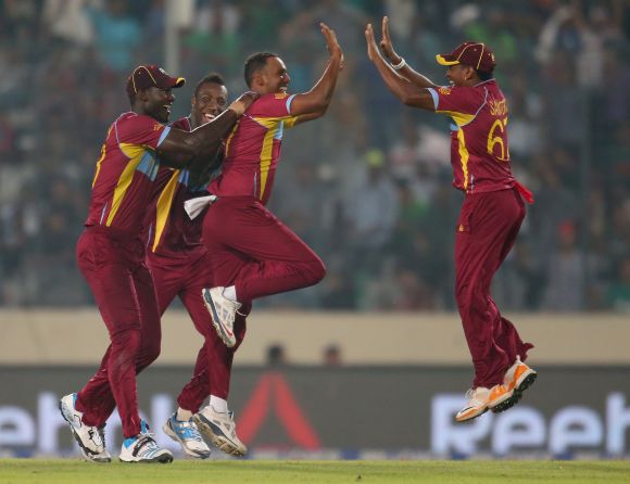 Samuel Badree celebrates after picking a wicket